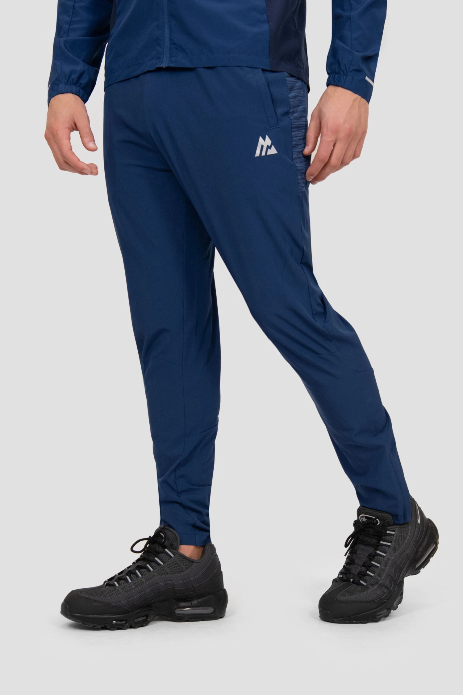 Trail Panel Running Pant - Navy Multi Trail Panel Running Pant - Navy Multi -MONTIREX CLOHTING SALE TRAIL 2.0 PANT ESTATE BLUE SET SAIL TRUE NAVY close side logo scaled